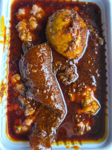 Ewa Agoyin with ponmo and egg